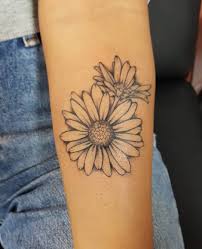 Daisy tattoo is gradually growing into popularity especially among ladies given the beautiful and appealing look it brings out when worn. Forget About Your Zodiac Sign These Gorgeous Birth Flower Tattoos Are So Much Better Birth Flower Tattoos Flower Tattoo Shoulder Flower Tattoos