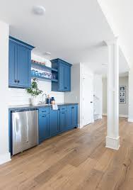 Larger cabinets that you can lock can also store items like hockey or lawn equipment. Basement Wet Bar Navy Cabinets The Lilypad Cottage