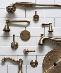 Made of brass, this faucet features a unique low gooseneck style spout and cross handles for an elegant touch to any bathroom. How To Choose Cohesive Bathroom Plumbing Fixtures Room For Tuesday