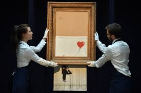 La artist vows to whitewash banksy painting on london bargain store after paying $700,000 for it in protest of street art being bought and sold. Clues And Legal Liabilities What Happened After Banksy Shredded His Own 1 4 Million Artwork