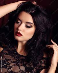 woman with dark hair and evening makeup