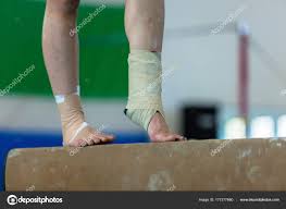 balance beam ankle strapped stock photo