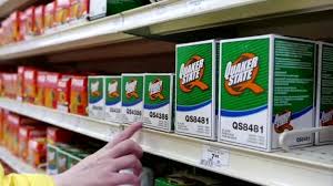 Woman Buying Quaker State Oil Filter Inside Canadian Tire Store