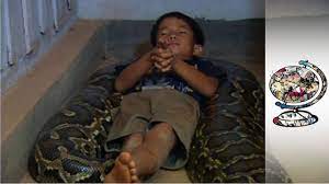 cambodian boy who sleeps with a python