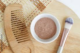 pink bentonite clay powder in the bowl