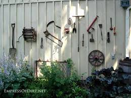 25 ways to dress up a fence with garden art