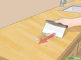 To clean wooden countertops, mix 1/2 cup baking soda in 1 quart warm water. 3 Ways To Clean Wood Countertops Wikihow