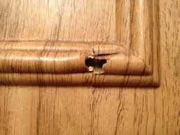 fix holes in veneer on kitchen cabinets