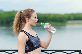 Young Beautiful Girl Holding a Bottle of Cool Water for Drinking Stock  Photo - Image of fresh, look: 120405038