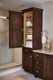 These vertical cabinets feature glass doors with drawers below for practical linen storage and decorative. Linen Closet Cabinet Aristokraft Cabinetry
