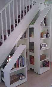 We like having a large and spacious place to enter our home, but under the staircase was unfinished and was like a no mans land. Image Result For This Old House Under Stair Pull Out Bookcase With Images Stair Decor Staircase Storage Basement Remodeling