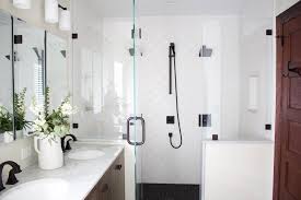 Modern farmhouse bathrooms this bathroom uses farmhouse white with subway tile and wood floors, but makes it more modern with black grout, industrial/retro lighting, simple mirror, black framed window and industrial sink. Kc Design Co Get The Look Modern Farmhouse Bathroom