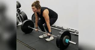 women powerlifters prepare for upcoming
