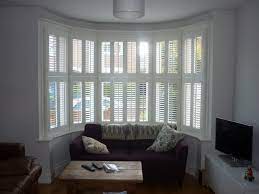 By using tiebacks, it allows the curtains and plantation shutters to frame the bay window, window seat or bed and lets them become the focal point of the room. Plantation Shutters For Bay Windows Expression Blinds