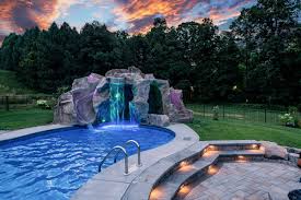 Most waterfall kits install in one or two days but they will last the lifetime of the pool because they are made of a high tech concrete mix. Poolside Water Features Rock Water Slides Waterfalls Grottos Oasis Outdoor Living