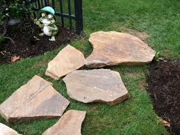 The hardest parts of the process are the labor of mixing the wet stone dust that serves as the pavers' base and then lifting and moving the stones. Building A Stone Walkway How Tos Diy