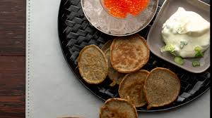 lemon blinis with caviar and scallion