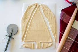 Pinch the middle seam to seal and stretch the dough to form a single triangle. Christmas Tree Bread Is A Tasty Holiday Twist King Arthur Baking