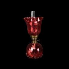 A Cranberry Glass Ball Font Oil Lamp