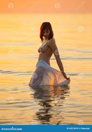 Nude Woman in the Sea at Sunset Stock Photo - Image of posing, lovely:  42275974