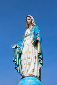 virgin mary statue on blue sky