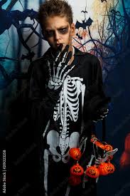 black makeup in skeleton costume stands