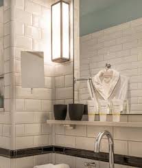 Art deco era bathroom is original, except for new plumbing fixtures. Bathroom Wall Light In Art Deco Design