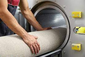 man operating drying machine for carpet