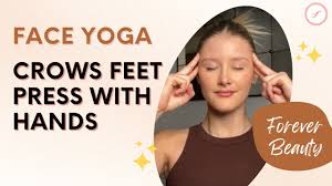 crows feet press with hands face yoga