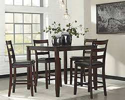 Chair seats upholstered in vinyl. Dining Room Sets Ashley Furniture Homestore