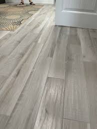 Choose a flooring that is soft and warm underfoot. I Want To Replace Carpet In My Bedrooms With Laminate Flooring And This Gray Tile Is Used Elsewhere Throughout The House What Color Laminate Should I Go With In The Bedrooms