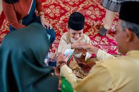 Celebrity pictures, creative arts and awesome pictures for your entertainment. Young Boy Being Presented With A Gift Of Money From His Grandparents As Part Of The Islamic Celebration Of Hari Raya Aidilfitri Eid Al Fitr Iproperty Com My