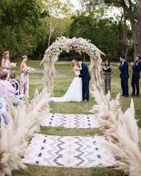 wedding ceremony aisle with bohemian rugs