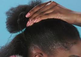Woman with stylish hair bun. How To Get A Sleek Bun On Black Natural Hair Superdrug