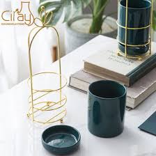 One of the benefits of ceramic plant pots is that they allow water and airflow at the sides. China Nordic Portable Dark Green Cylinder Ceramic Planter With Saucer And Gold Stand China Plant Pot And Ceramic Plant Pot Price