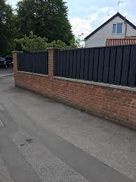 fence panels on top of wall