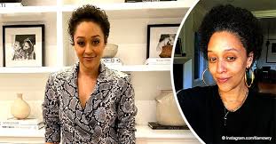 tia mowry shows natural grey afro in