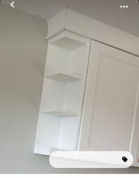uneven cabinet widths next to window