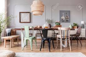 Free shipping and easy returns on most items, even big ones! Different Kid Of Chairs At Table With Flowers And Food In Rustic Dining Room Interior With Lamp And Posters Real Photo Stock Photo Picture And Royalty Free Image Image 110973450