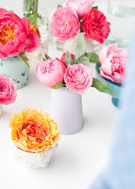 For added texture and style, you can hold your flower bouquet in a complimentary colored wrapper. The Art Of The Mini Arrangement How To Quickly Arrange Teeny Tiny Bouquets In Vases Paper And Stitch