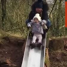 Happy little kids on sledge. Kid Slowly Goes Down Slide Videos From The Weather Channel Weather Com