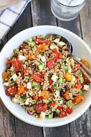 Transfer to a serving bowl and garnish with the chopped pistachios. Israeli Couscous Salad With Summer Vegetables Green Valley Kitchen