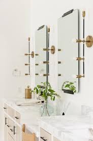 Linear Brass Lights With Vintage Vanity Mirrors Transitional Bathroom