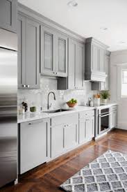 grey cabinets and dark hardwood floors