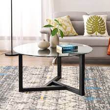 The coffee table is the piece of resistance in the living room. Round Tempered Glass Top Coffee Table Overstock 31958587