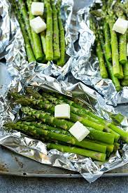 To roast asparagus, trim the ends then lightly coat them with a bit of olive oil and spread in a sheet pan. Grilled Asparagus In Foil Dinner At The Zoo