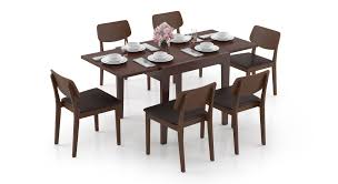 Trying to pick a dining table can take a bit of work, mostly because there is a lot to consider. Murphy 4 To 6 Extendable Lawson 6 Seater Dining Table Set Urban Ladder
