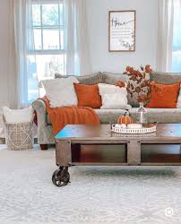 neutral living room with burnt orange