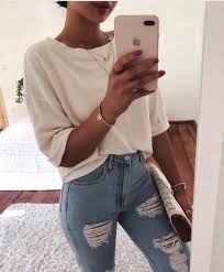 Loose Fit White Top And Ripped Light Blue Skinny Jeans For