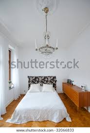 Rated 5 out of 5 stars. Bright Bedroom With White Walls And Spartan Chandelier Stock Images Page Everypixel